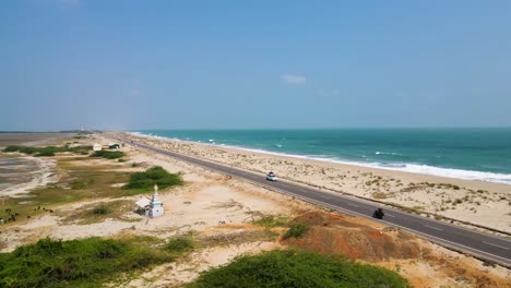 majestic aerial drone shot revealing the untouched landscapes and serene waters of dhanushkodi.