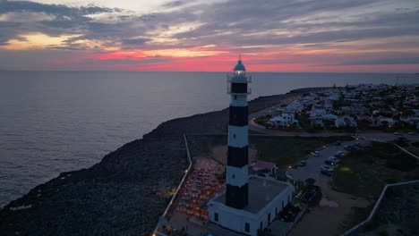 drone view of menorca lighthouse at golden hour
