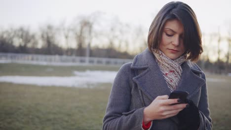 young beautiful business woman using smartphone, surfing the internet.