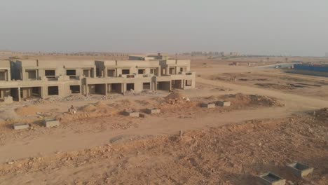 aerial view over construction development in karachi. tracking shot