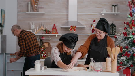 happy family celebrating traditional christmas holiday preparing gingerbread cookies