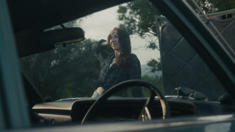 woman stranded with a broken down car