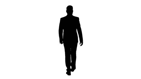 silhouette of confident businessman walking