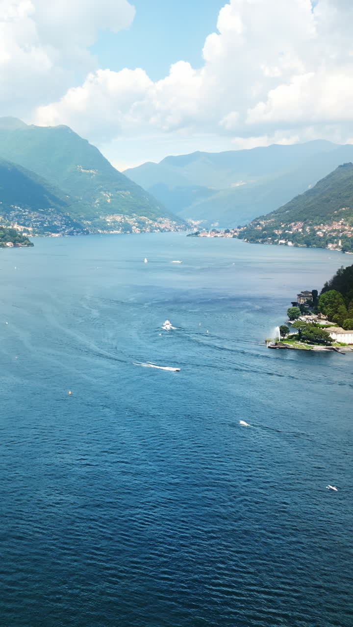 Aerial, drone view of Como, Italy on the shore of Lake Como. Vertical