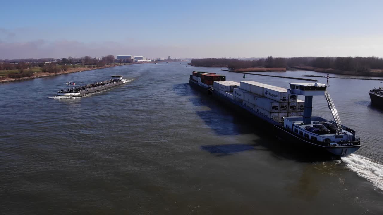 Shipping Containers Carried By Barge At Daytime In Oude Maas River In Netherlands. - aerial