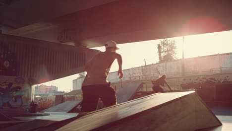 Active-people-riding-together-at-urban-skate-park.-Friends-practicing-outdoors