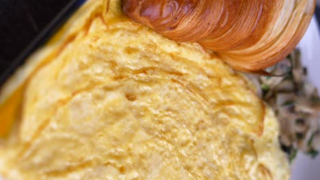 delicious breakfast omelette with croissant