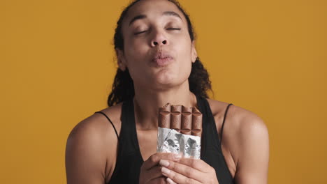 african american happy woman over yellow background.