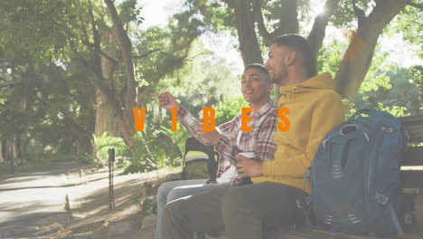 animation of vibes text over smiling diverse male friends drinking coffee