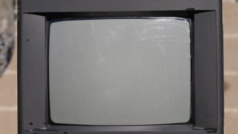 water hits old tv screen