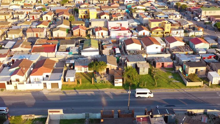 Aerial over townships of South Africa with poverty stricken slums streets and ghetto buildings 4