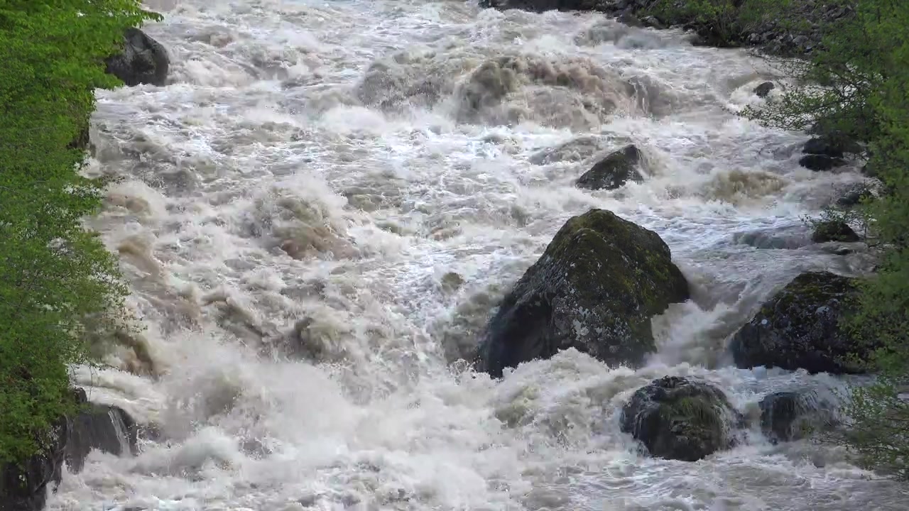 Rushing River Water Flowing Over Rocks in Nature