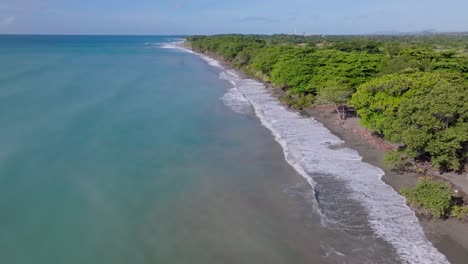 Waves-breaking-on-Palenque-beach,-San-Cristobal-in-Dominican-Republic