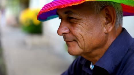 senior man wearing a colorful hat