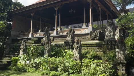 stone statues guarding royal pavilion inside ubud palace, officially puri saren agung, is a historical building complex in ubud, gianyar regency of bali, indonesia