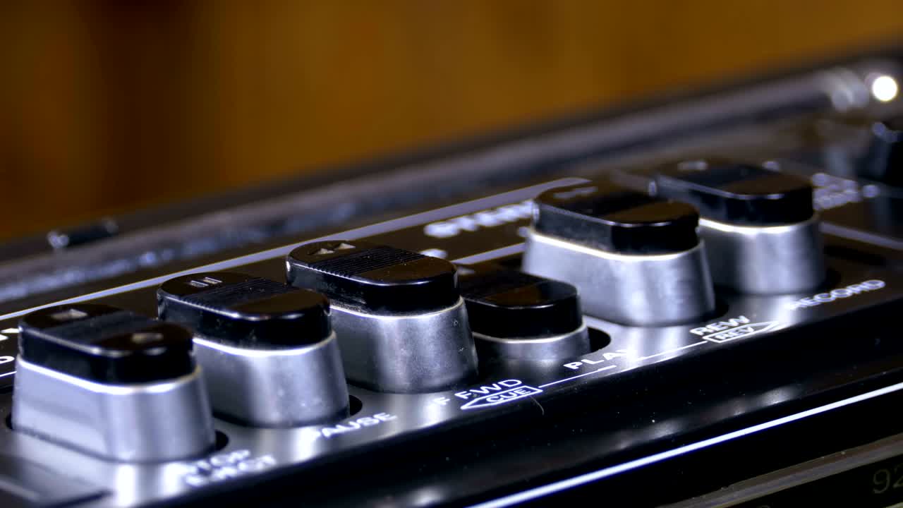 Pushing Button on a Tape Recorder, Play, Stop, Rec, ff, Rew