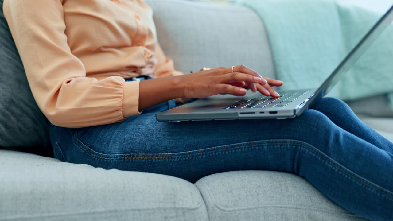 Black woman, hands or laptop typing on sofa