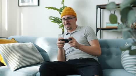 Man Playing Video Games on Couch