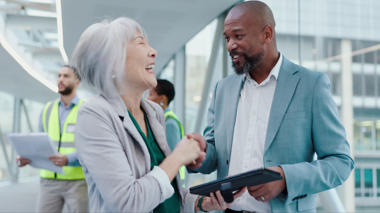 Business people, tablet and handshake