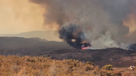 aerial shot of a scary but beautiful fire in the mountains manifesting the circle of life