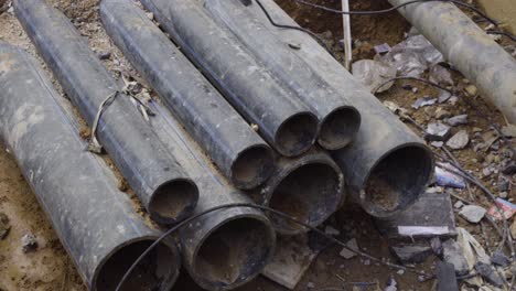 group of pipes laid down for construction of a drainage in between the street