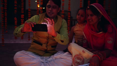 young parents with daughter celebrate decorate for diwali festival