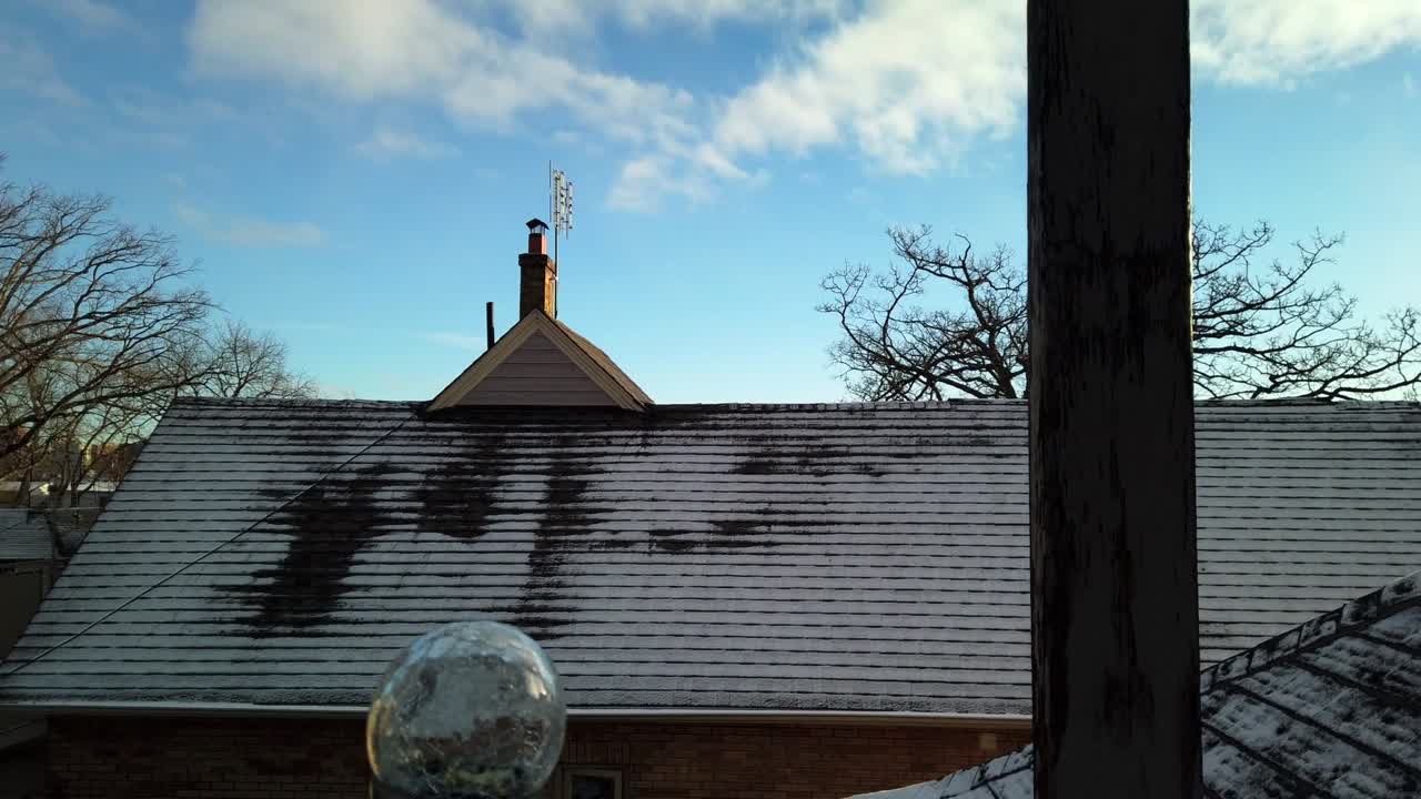 Early morning panning time-lapse of houses and rooftops