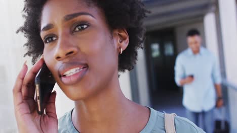 Video-of-african-american-businesswoman-using-smartphone-on-office