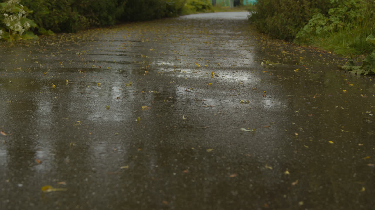 Close Up Of Woman Legs As She Exercises Keeping Fit Running In Rain 1