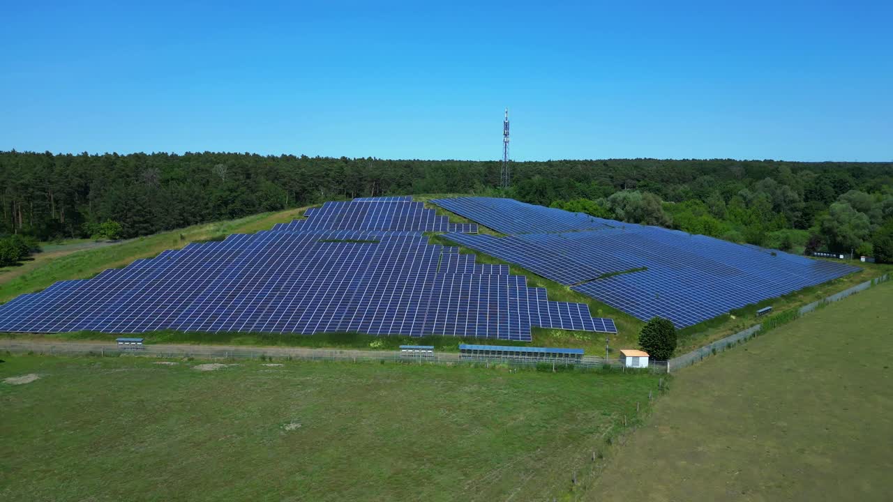 solar panels on Hill transforming a waste site into a source of renewable energy, a sustainable solution for the future. speed ramp hyper motion time lapse Marvelous aerial view flight