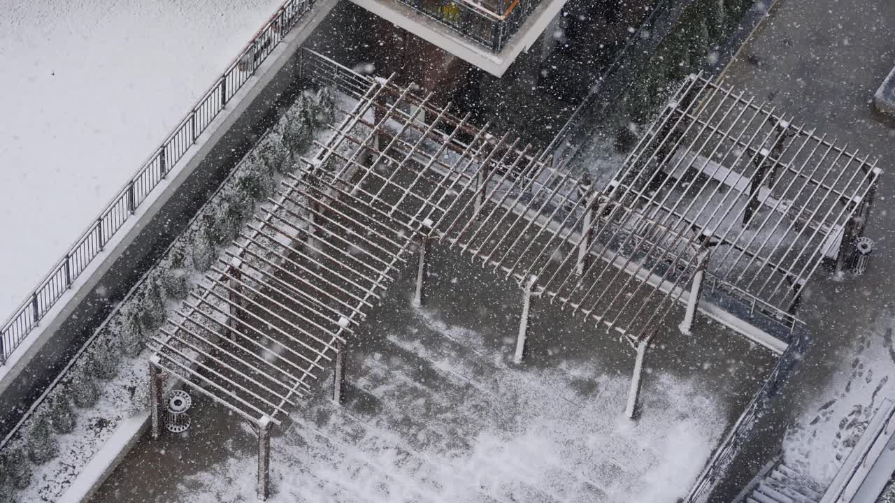 Snowy Urban Rooftop with Pergolas