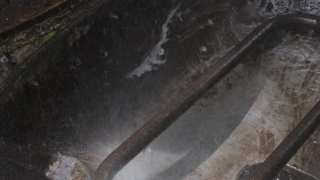 washing a greasy outdoor grill