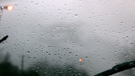 windscreen wiper wiping rain away from car window