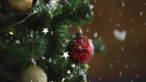animation of stars falling over christmas tree with decorations on dark background