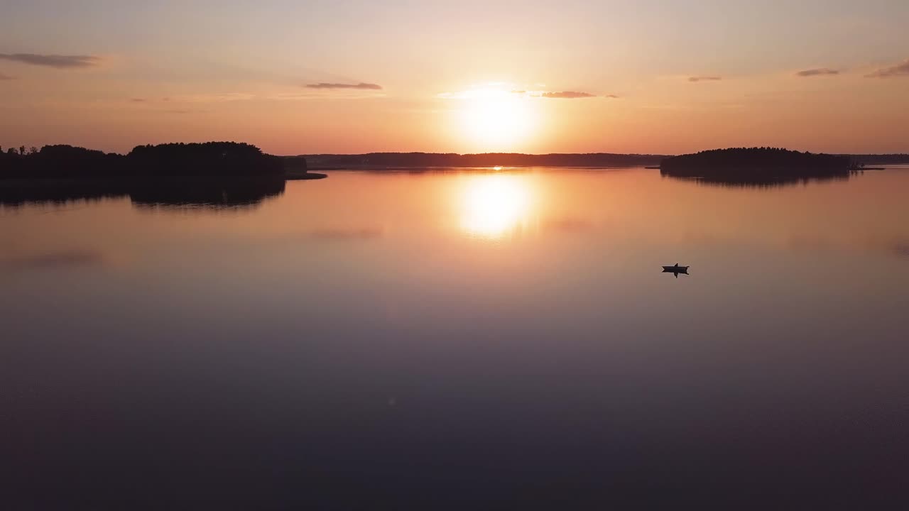 Sunset Over Lake Aerial. Slow Forward Move