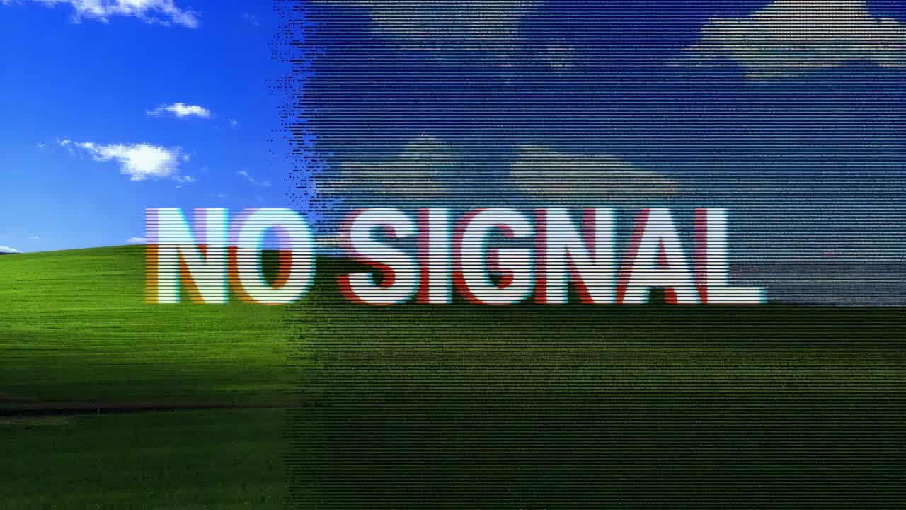 กำลังแสดงผลภาพซ้อนทับ NO SIGNAL ที่กึ่งกลางซึ่งสั่นบนหน้าจอมอนิเตอร์ การสูญเสียสัญญาณทำให้เกิดสัญญาณรบกวนของพิกเซล