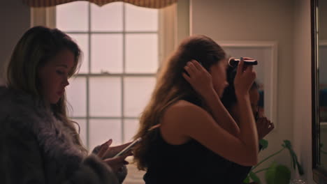 happy-girl-friends-getting-ready-looking-in-mirror-applying-makeup-teenagers-preparing-going-out-wearing-stylish-fashion