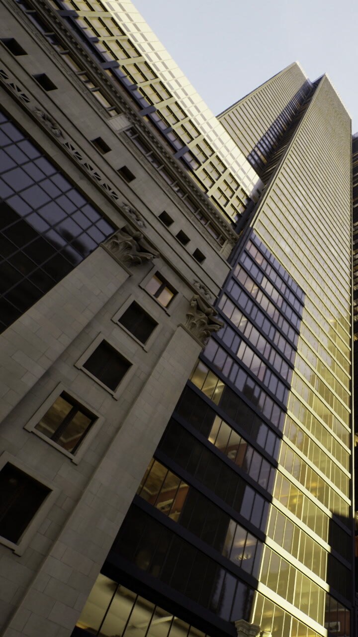 View of buildings looking up from the street in a city during the day