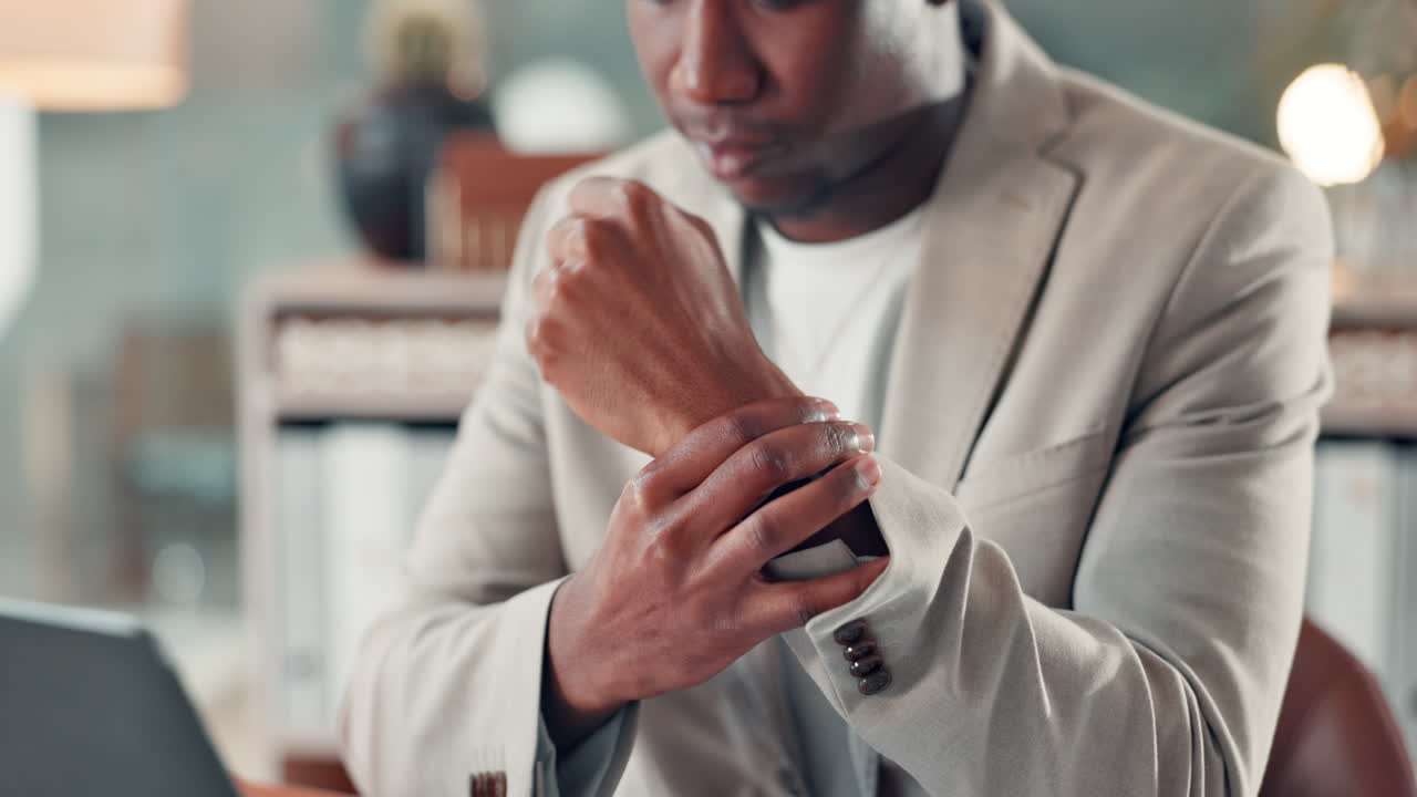 Man experiencing wrist pain at the office