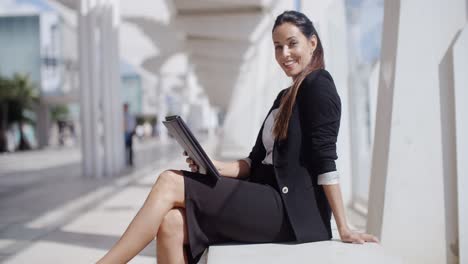 Elegant-business-manageress-working-on-a-laptop