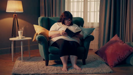 woman reading in a cozy armchair