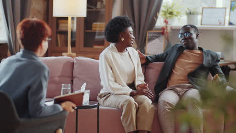 african american couple making up and saying thanks to psychologist