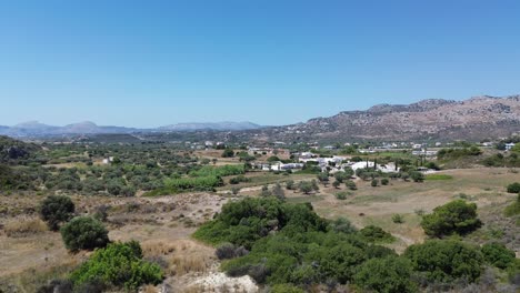 Green-Forest-in-Rhodes-with-seaside-in-the-background-in-Greece-during-the-summer-filmed-with-the-drone-in-4K