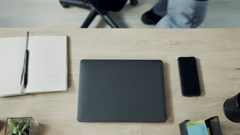 hands, person above and typing on laptop