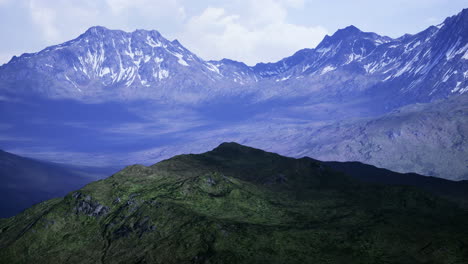 majestic mountain range under a serene cloudy sky at dawn
