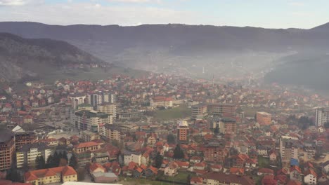 panorama of tutin town and municipality with fog raska, serbia