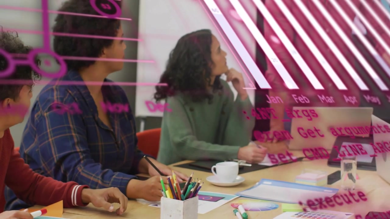 Lead gesturing, team choosing swatches to set palette in design lab, pink rings drifting over table