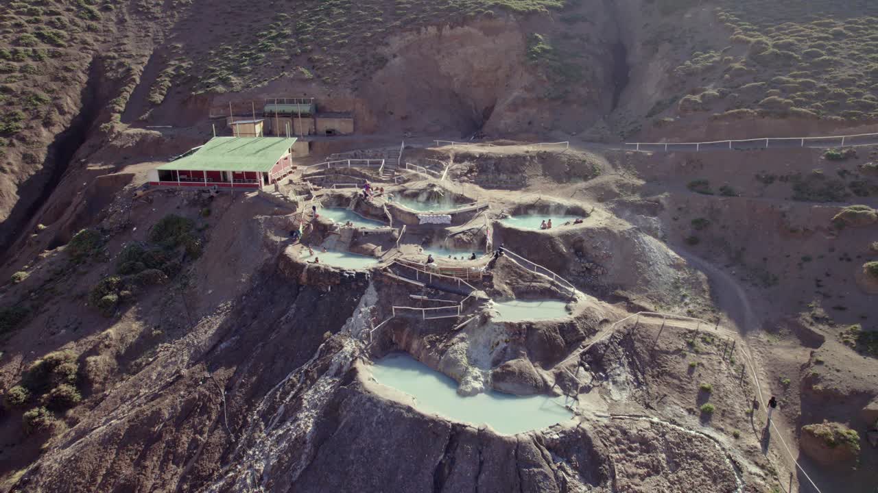 Tourists At The Hot-Spring Valley With Outdoor Mineral Pools In Termas Colina Near Santiago, Chile