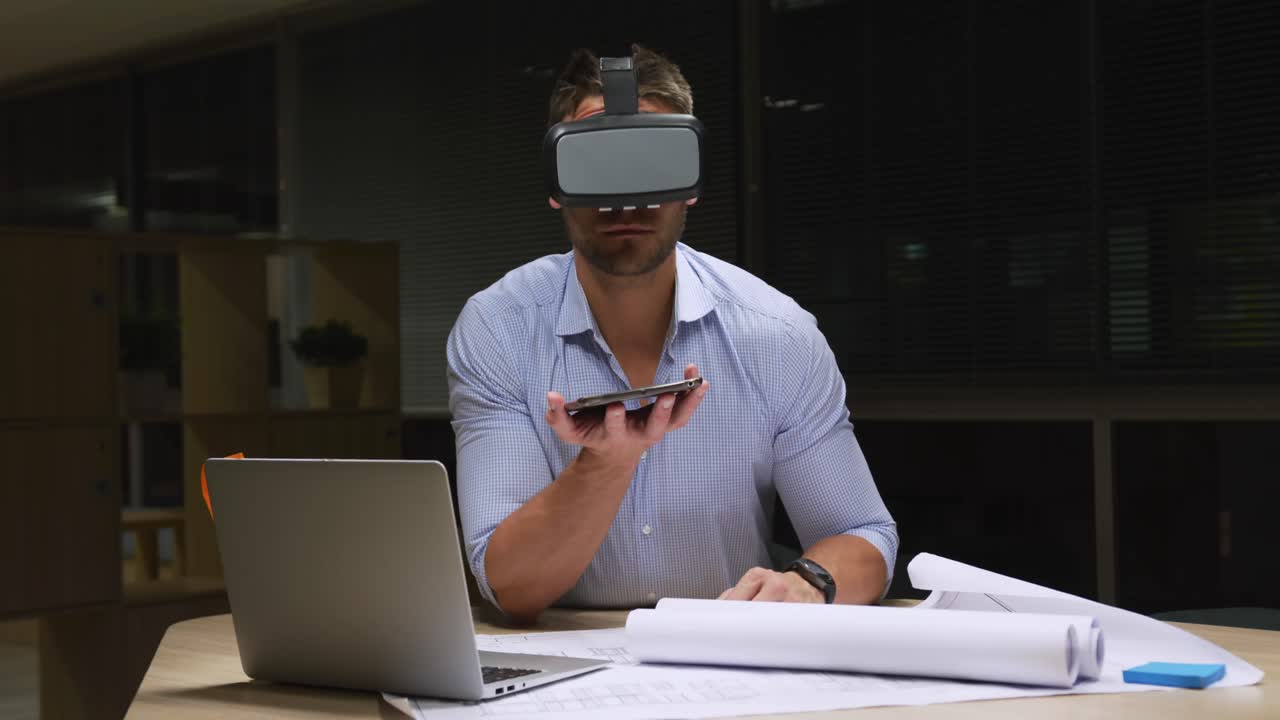 Businessman using VR helmet in a modern office