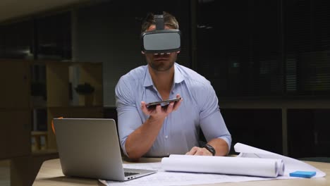 businessman using vr helmet in a modern office